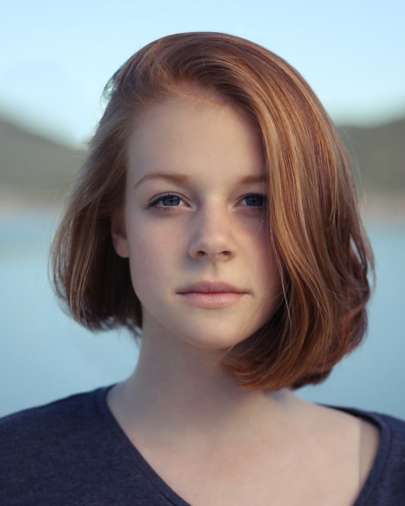 Portrait of Mira by the kitchen window in early light